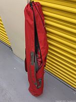 Red carry bag standing upright