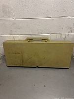 Folded suitcase-style picnic table closed