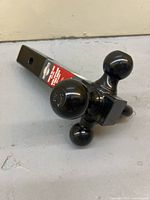 End view of tri-ball hitch showing three different ball sizes