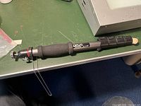 Full view of the camera monopod showing the length, foam grip, universal head, and cork foot replacement.