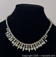 Front view of vintage Sherman rhinestone choker on black display bust, showing the single strand and dangling rhinestones.