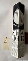 Original tall box front showing String Light branding and illustration of assembled lamp