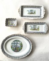 Photo of all four Royal Albert Silver Birch serving pieces arranged on white background.