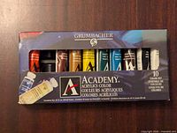 Photo of the front of the box showing 10 acrylic paint tubes.