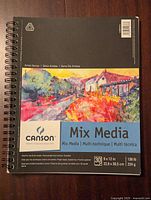 Front view of Canson mix media paper pad showing label and cover artwork
