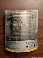 Front view of the unopened Seagate FreeAgent Go Portable Drive packaging showing product name, capacity 250GB, USB 2.0, and warranty information.