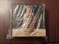 Front view of unopened Hugo Boss cologne gift set in original shrink wrap showing branding and partial details.