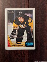 Front side of the 1987-88 Mario Lemieux O-Pee-Chee hockey card featuring Lemieux in Penguins uniform.