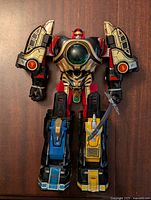 Front view of Thunder Megazord robot figure assembled showing colorful parts and some wear