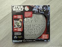 Front of the boxed Star Wars Death Star Electronics Lab showing the product, branding, and highlighted features on the packaging.