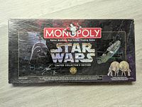 Front of Star Wars Monopoly Limited Collector's Edition game box showing Star Wars themed artwork.