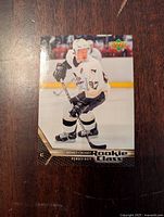 Front photo of the Sidney Crosby hockey card showing the player in white uniform with Rookie Class label.