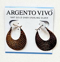 Front view of pair of gold-tone textured hoop earrings on Argento Vivo branded card, showing scale-like pattern and overall shape.