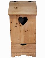 Front view of pine wooden storage box with heart-shaped cutout vent and slanted hinged lid