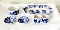 Photo of all six Spode Blue Italian ceramic pieces displayed together on white cloth.