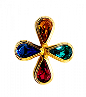 Front view of the Swarovski brooch showing four large faceted teardrop crystals in amber, blue, green, and pink on gold-tone metal.