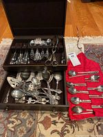 Overall view of entire silverware flatware set in storage box plus chopsticks and spoon set
