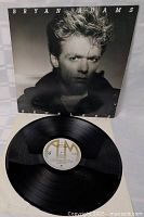 Vinyl LP record disc with label visible showing A&M Records logo and track details.