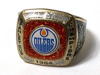 Front and angled view of 1984 Edmonton Oilers Stanley Cup Champions ring with team logo and championship details visible.