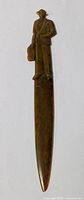 Full length view of vintage letter opener featuring man figurine on handle