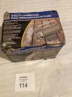 Original box labeled '12 Volt Marine Utility Pump' with specifications and usage warnings.