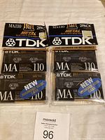 Photo of four TDK MA110 blank cassette tapes in two original sealed 2-pack packages with labels showing metal type IV and 110 minutes each.