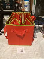 Photo of orange collapsible shopping bag showing internal dividers and handles