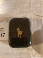 Front view of a soap bar with Polo Ralph Lauren gold logo on black packaging.