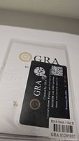 GRA certification booklet and card with gemstone details