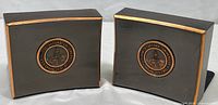 Pair of vintage copper bookends with Stanford University emblems on front, showing overall shape and condition.