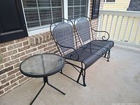 Front right angle showing bench and side table on porch
