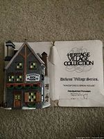 Porcelain Kingsford's Brew House and heritage information booklet showing branding and series details.