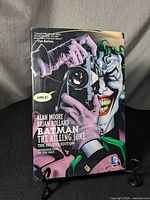 Front cover of the hardcover graphic novel with colorful Joker artwork and title text.