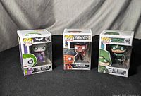 Three unopened Funko Pop! boxes: The Joker #36, Hancock #77 Fallout 4, Green Arrow #207.