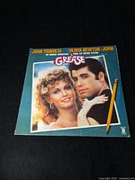 Front cover of Grease original soundtrack vinyl featuring John Travolta and Olivia Newton-John