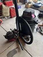 Black Craftsman wet/dry vacuum showing hose, tank, and motor with label indicating 5.0 peak HP and 16 gallon capacity.