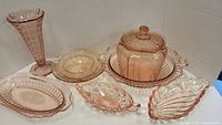 Overview of entire lot showing vase, covered jar, casserole with underplate, bowls, plates and trays