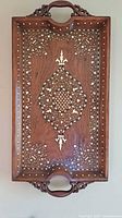 Top view showing full tray, carved handles, bone inlay pattern