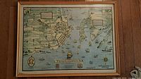Full view of framed historical map print with wood frame