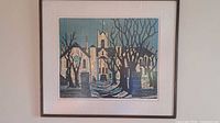 Framed woodcut print on wall