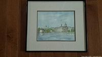 Full view of framed watercolor painting under glass