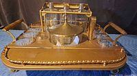 Front angled view showing tray, decanters, ice bucket, and glasses