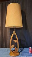 Lamp with shade, full view next to soda can for scale