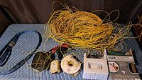 All items laid out: LED leash, transmitter, bark collar, boundary wires, adapter, box