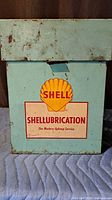 Front view showing Shellubrication graphic, lid, clasp, rust