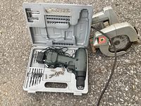 Circular saw and cordless drill in case with accessories