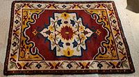 Full view of Turco-Persian hand-hooked wool rug showing entire pattern and colors