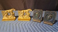 Front view of both dog and theater mask bookend pairs