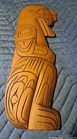 Front view of carved wood bear figure