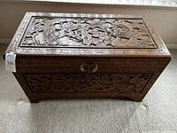 Overall front and top view of carved chest